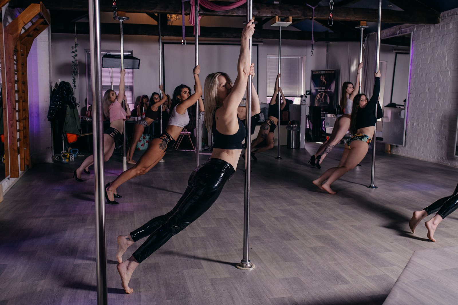 Women training in a pole and aerial class at Sxefit Studios